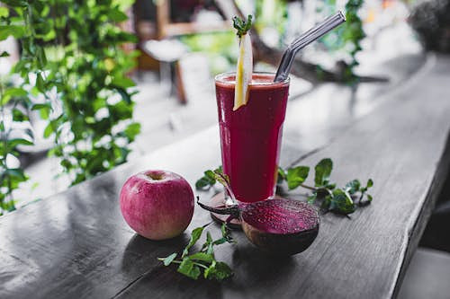 Free Refreshing beetroot and apple juice garnished with mint leaves, perfect for a healthy detox. Stock Photo
