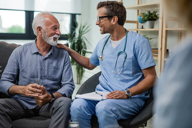 I'm glad to see you doing well! Happy doctor talking to senior male patient while being in a home visit. meet doctor stock pictures, royalty-free photos & images